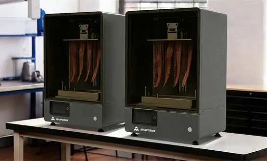 Which Desktop Stereolithography 3D Printer Minimizes Material Waste Most Efficiently?